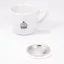 Seal for Bialetti moka pots next to a coffee cup.