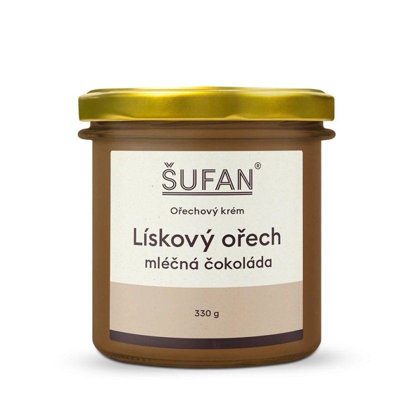 Haselnussbutter mit Milchschokolade in einem Glastiegel mit goldenem Deckel