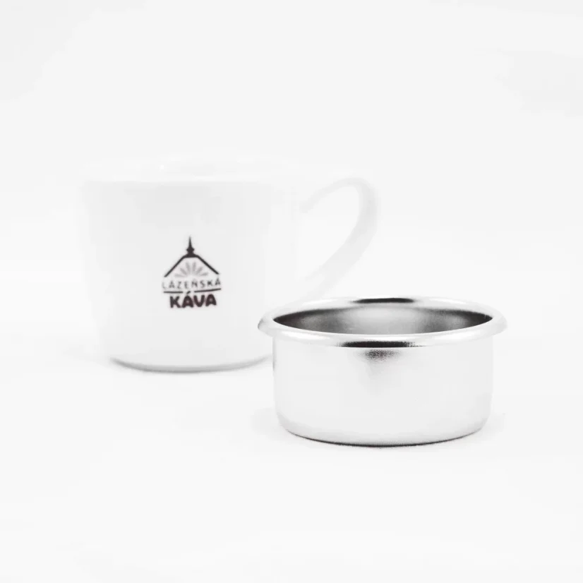 IMS silver basket on a white background with a cup; Portafilter baskets