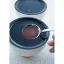 RhinoWares cupping spoon in a white cupping bowl filled with coffee.