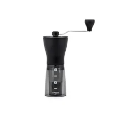 Ručný mlynček na kávu s čiernou násypkou na kávu