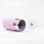 Pink thermos flask with a capacity of 295 ml lying on a white background with a coffee cup.