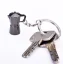 Silver keychain pendant in the shape of a moka pot, an ideal gift for coffee lovers.