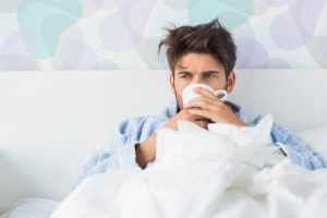 What are the effects of drinking coffee when sick. Does it help or harm?