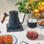 Fellow Stagg EKG Electric Pour-Over Kettle in blue with a wooden handle and Fellow pour-over set.