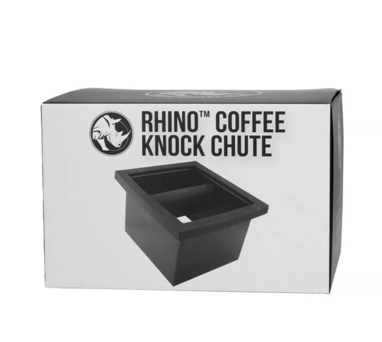 Built-in black knock box for used coffee in original packaging on a white background