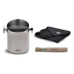Lelit stainless steel knock box cylinder with cloth and brush.