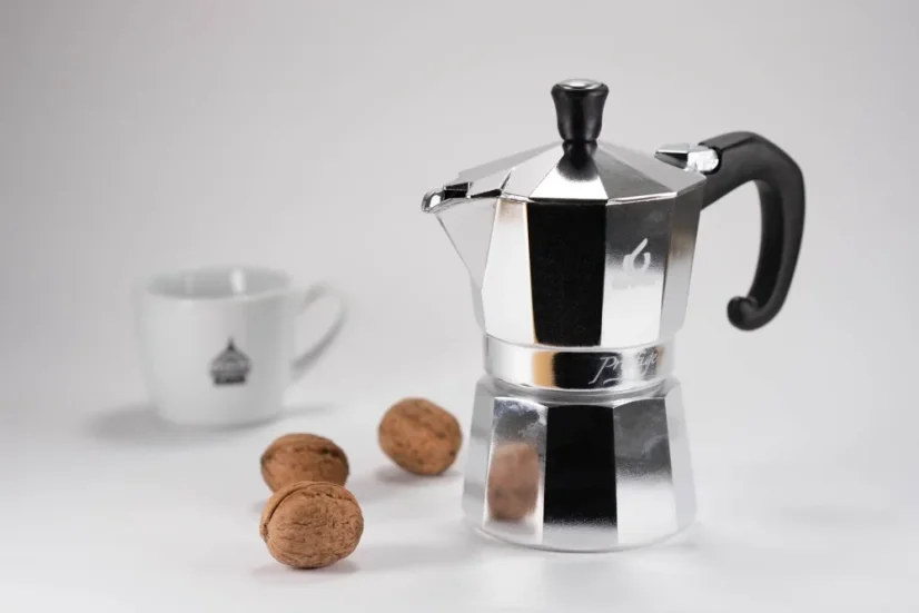 Forever moka pot, nuts, and a cup of coffee