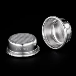 Two silver IMS baskets on a black background, viewed from below and inside. Two silver IMS baskets on a black background, viewed from below and inside.