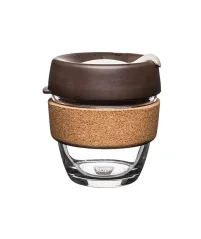 Glass thermal mug with brown lid and cork holder
