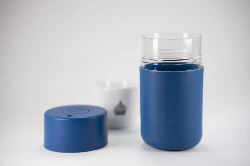 Blue Frank Green thermos in Deep Ocean color with a coffee cup