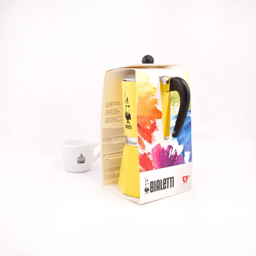 Paquete Bialetti Rainbow 6 en color amarillo con café en el fondo.
