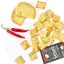 Scattered Luhačovice Gouda crackers complemented by a piece of aged cheese and chili