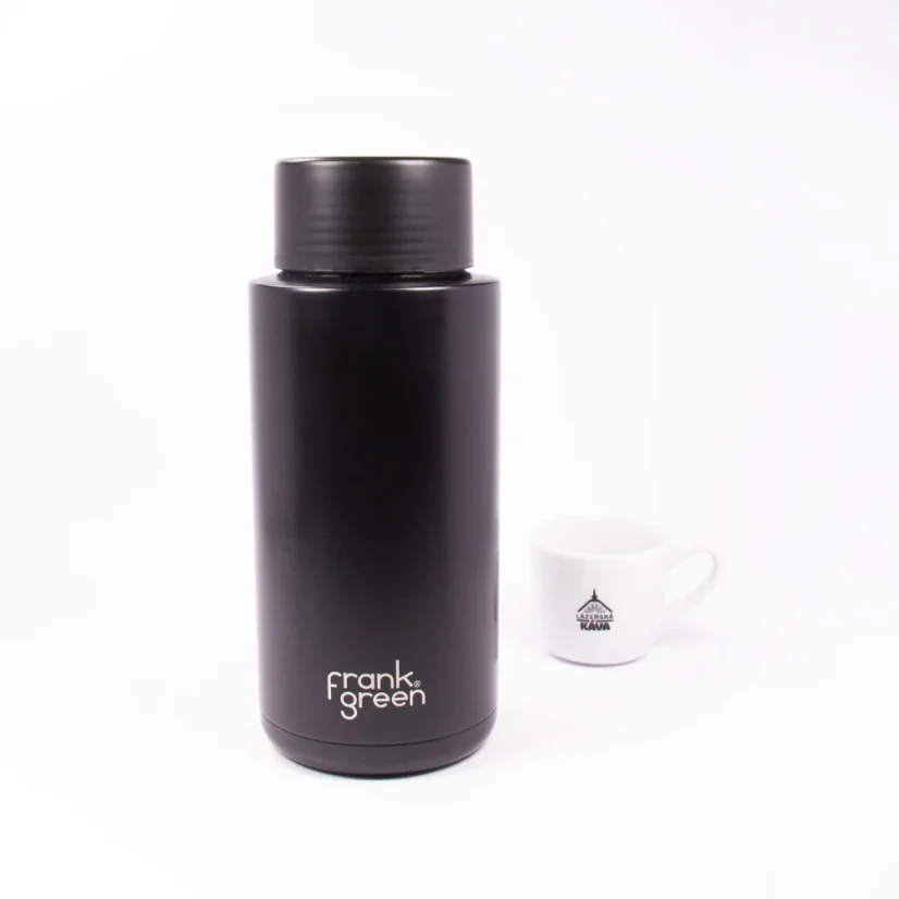 Ceramic thermos from the front with a coffee background
