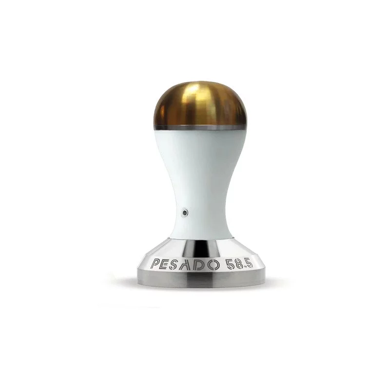 Tamper with a white handle and gold head from Pesado with a 58.5 mm base.