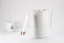 White Timemore Fish Pure Over gooseneck kettle in a rear view on a white background with a porcelain cup