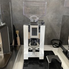 White Eureka Mignon Specialita 16CR espresso grinder with steel burrs.