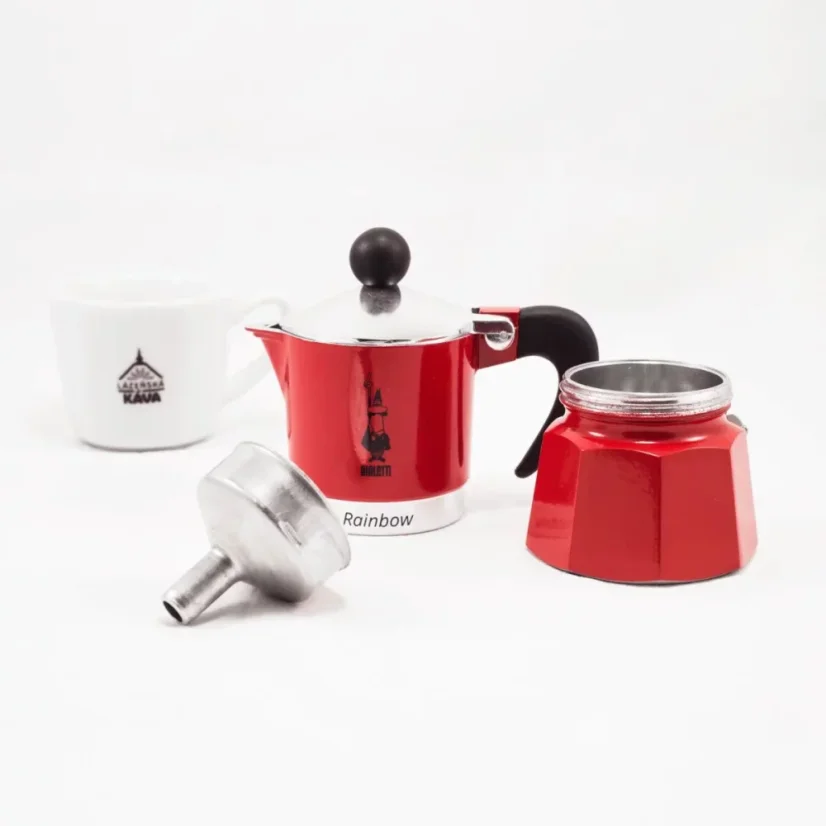 Disassembled Bialetti Rainbow 1 Moka pot in red color with coffee grounds.