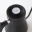 Detail of the lid of the Fellow Stagg kettle in black ceramic with a capacity of 1000ml