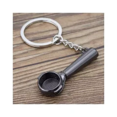 Coffea schwarze Presse ist ein stilvoller Schlüsselanhänger in elegantem Schwarz, ideal als Geschenk für Kaffeeliebhaber.