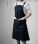 Black barista apron with straps, ideal for professional baristas.