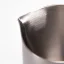 Silver Subminimal Flowtip milk jug on a white background, detail on the spout of the jug.