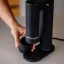 Acro 2-in-1 coffee grinder with quick magnet attachment of the bottom container