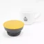 Yellow lid for the Kino Travel Tumbler Coyote 500ml with a white coffee cup in the background Yellow lid for the Kino Travel Tumbler Coyote 500ml with a white coffee cup in the background