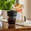 Trinity Zero on a container and placed on a table next to a pack of coffee.
