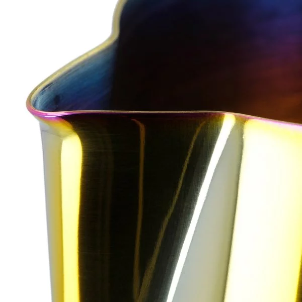Close-up view of the spout of a Barista Space rainbow milk frothing pitcher