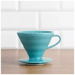 The Hario V60-02 dripper in a beautiful turquoise blue finish is made from high-quality porcelain and comes with 40 filters.