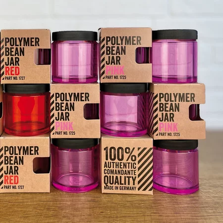 Pink coffee caddy by Comandante, an ideal accessory for every coffee lover.