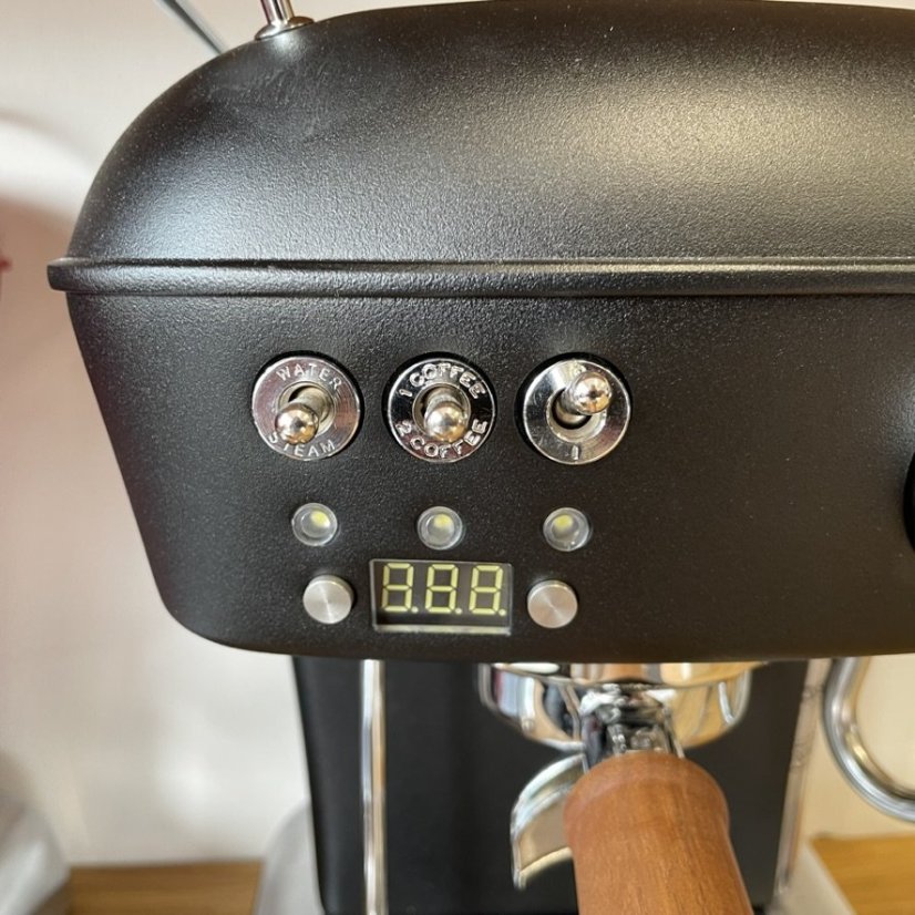 Home lever espresso machine Ascaso Dream PID in Dark Black color with an aluminum body.