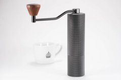 The Timemore Slim Plus grinder has an aluminium body and a wooden handle