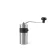 Silver manual coffee grinder on a white background