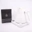 White electric kettle on a white background with a package of spa coffee