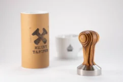 Stainless steel 53 mm Heavy Tamper Zebrano with a cup of coffee Stainless steel 53 mm Heavy Tamper Zebrano with a cup of coffee