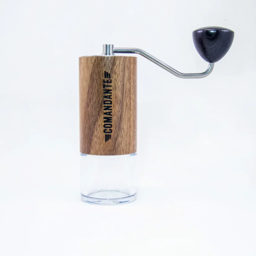 Hand-operated Comandante C40 MK4 Nitro coffee grinder with Virginia Walnut and glass materials.