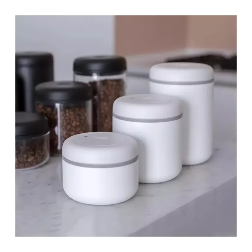 Fellow Atmos coffee canister in white color with a capacity of 1200 ml keeps your coffee fresh thanks to its vacuum seal.