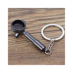 The black keychain coffee portafilter is the perfect gift for coffee lovers, standing out with its elegant black colour. The black keychain coffee portafilter is the perfect gift for coffee lovers, standing out with its elegant black colour.