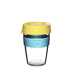 KeepCup coffee cup with a yellow lid and transparent plastic body.