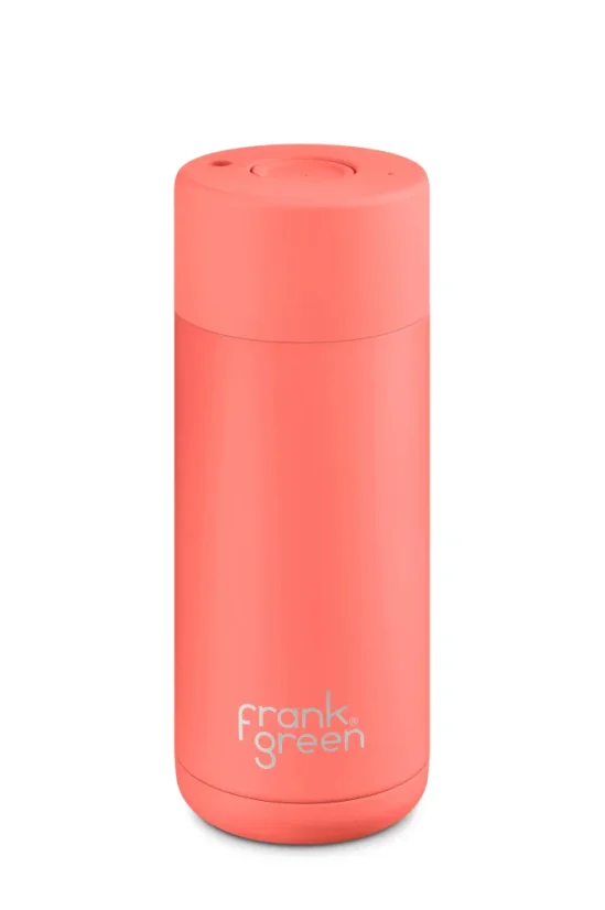 Orange Frank Green Ceramic travel mug with a 475 ml capacity, perfect for traveling.