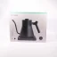 Black electric kettle in original packaging on a white background