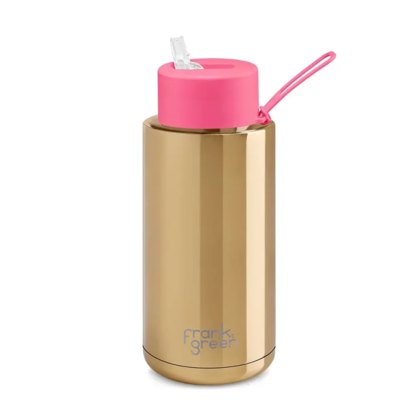 Frank Green thermos mug with a capacity of 1000 ml featuring a drinking spout, gold body and pink lid.