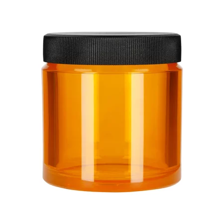 Orange coffee storage container from Comandante, ideal for storing coffee.