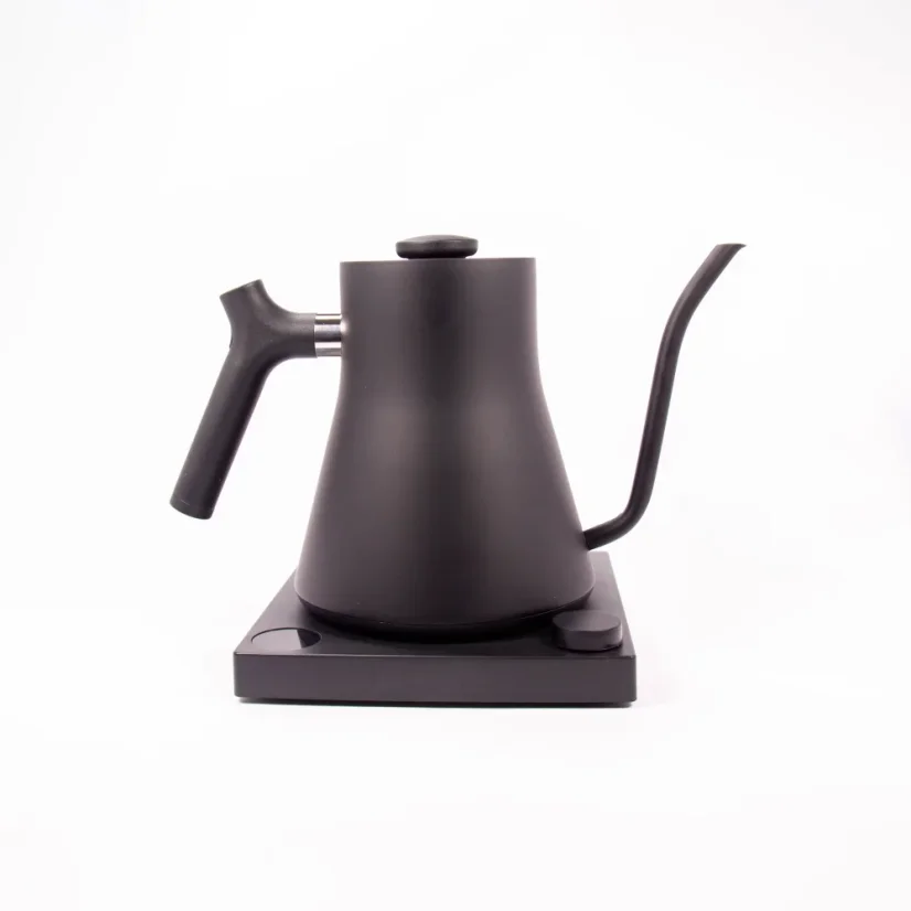 Black electric kettle on a black base against a white background, side view