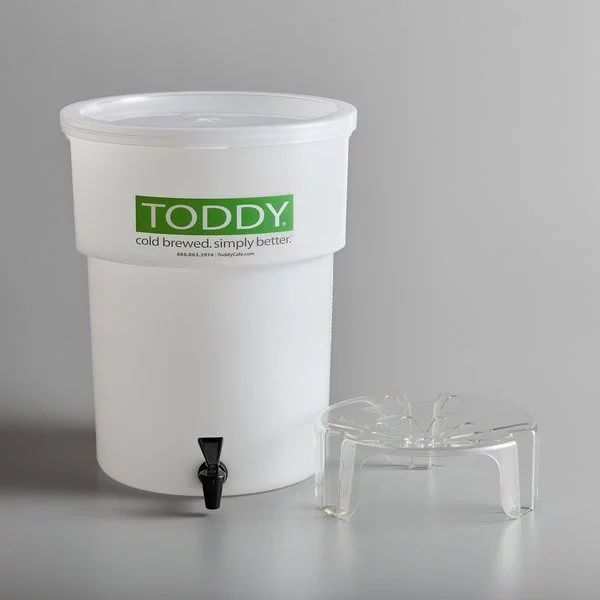 White plastic container for cold macerated cold brew coffee preparation by Toddy, accompanied by a plastic base