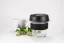 Glass thermal mug with a black lid and black rubber holder, 227 ml capacity, featuring a cup of coffee and a small branch.