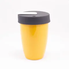 Yellow Loveramics Nomad thermal mug with a capacity of 250 ml, suitable for use in cars.