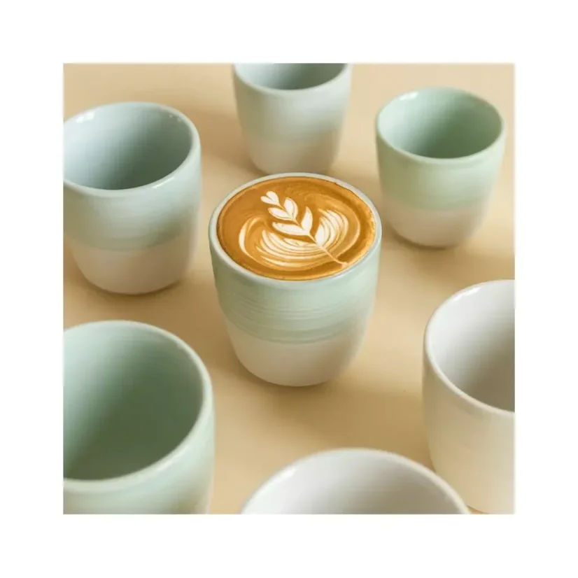 A porcelain cup in a refreshing celadon green colour, perfect for serving your favourite flat white, with a capacity of 150 ml.